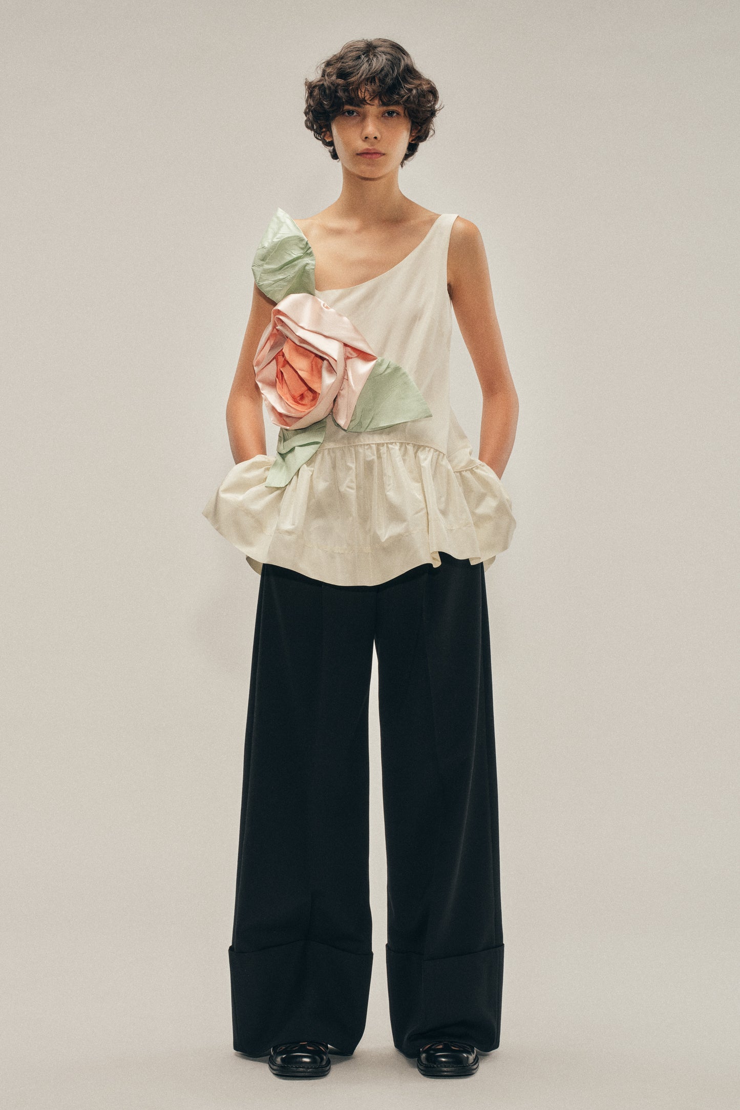 Pressed Rosette Tilted Neck Peplum Top